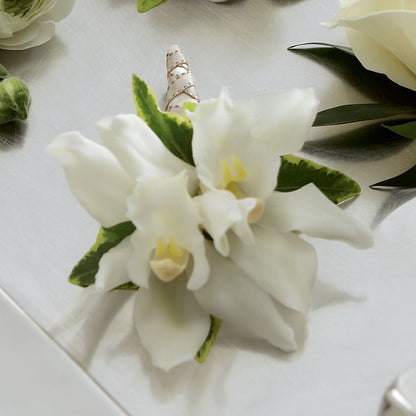 White Mini Cymbidium Boutonniere –  Kay Penny Florist, Hamilton ON